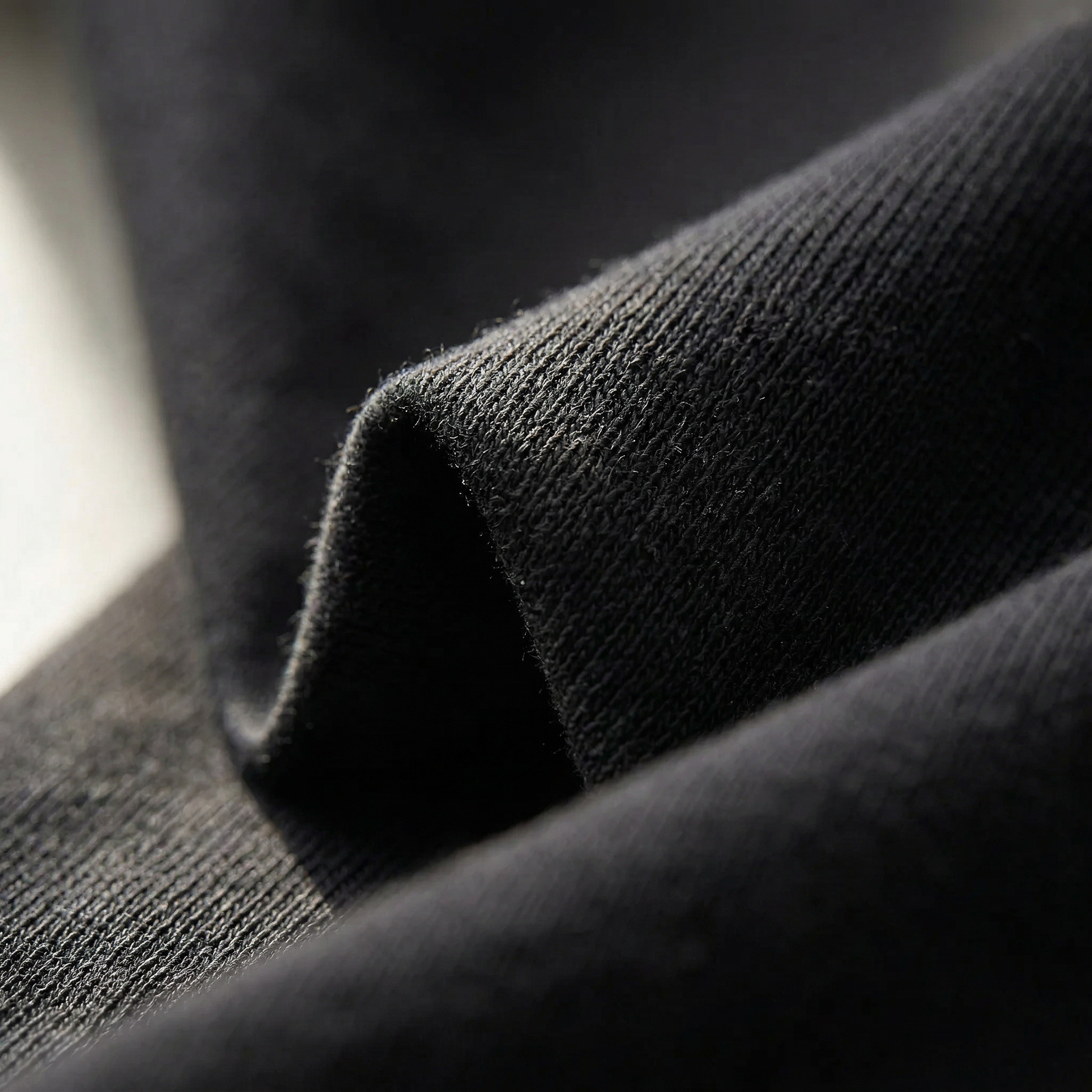 RIO Standard 240gsm — Noir doux — détail texture coton 240gsm